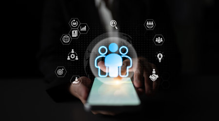 Glowing human figures surrounded by business icons representing HR data analysis, employee management, and recruitment analytics Parseの写真素材