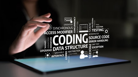 A business professional engages with an illuminated tablet showcasing essential coding terms,...