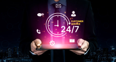 Concept of 24-hour customer service. Providing constant, non-stop support and assistance through...