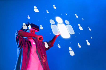 Explore the future of digital networking as a person engages with virtual reality, illustrating connection and communication in cyberspace and revolutionizing interactions.の写真素材