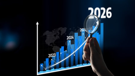 A professional hand holds a magnifying glass over a chart illustrating business growth trends from...