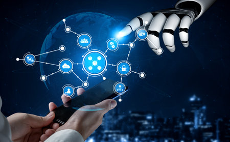 The image highlights the interaction between a human hand with a smartphone and a robotic hand,...