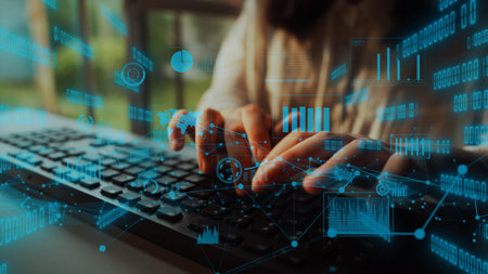 Close-up of hands typing on a computer keyboard, surrounded by transparent digital data...
