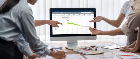 Project planning software for brisk business project management on the computer screen showing...