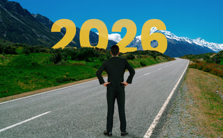 2026 New Year journey and future vision concept . Businessman traveling on highway road leading...