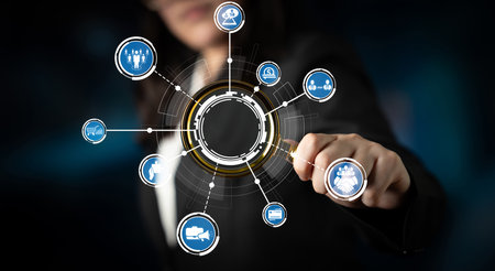 A professional businesswoman engages with a futuristic digital interface, symbolizing technology,...