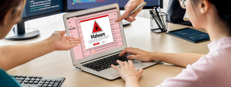 Cyber attacking concept. Malware alert showing on computer screen display scam and threat detection on computer system or online server to be removed brisk.の写真素材