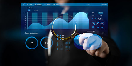 A business professional engages with a high-tech data dashboard, analyzing performance metrics and...