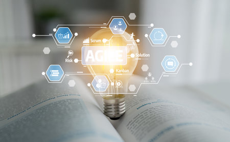 A light bulb illuminates an open book, symbolizing innovation and agile methodologies in project...