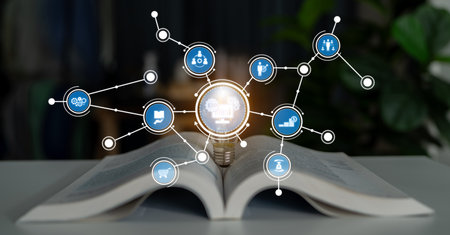An open book with a light bulb symbolizes knowledge and ideas, surrounded by icons that represent innovation, technology, and learning concepts in a modern environment.の写真素材