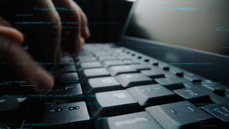 A close-up shot capturing hands actively typing on a laptop keyboard, with an overlay of glowing...