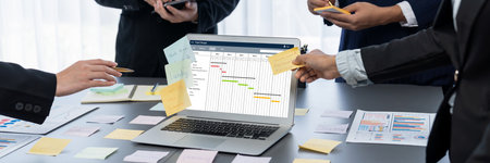 Project planning software for brisk business project management on the computer screen showing...