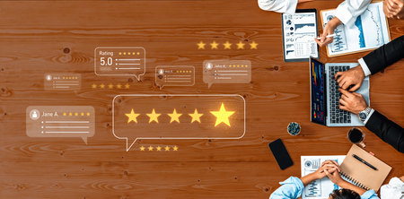 A high-angle view of business professionals discussing customer feedback and ratings at a wooden...