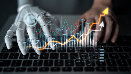 A striking concept showing a robotic arm and a human hand working together on a keyboard surrounded by charts and data trends highlighting the future of technology in business.の写真素材