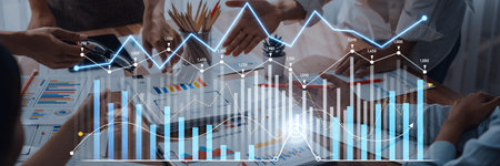 A business team collaborates in a modern office, analyzing financial growth strategies with charts...