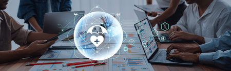 A dynamic workspace showcasing professionals engaged in digital health analysis, reflecting collaboration and innovation in modern technology and care solutions.の写真素材