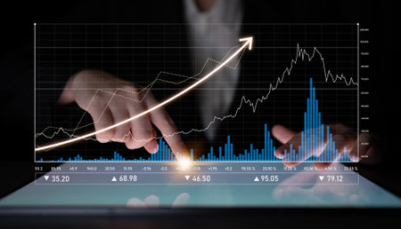 A professional business analyst interacts with data visualization on a digital tablet. The sleek...