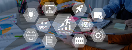 A vibrant workspace scene showcasing teamwork and productivity with digital tools, icons representing business growth, and creative brainstorming in progress. Gantryの写真素材