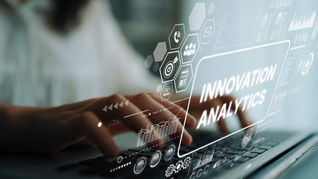 Close-up of Hands Typing on Laptop with Digital Innovation Analytics Interface in Modern Workspace....