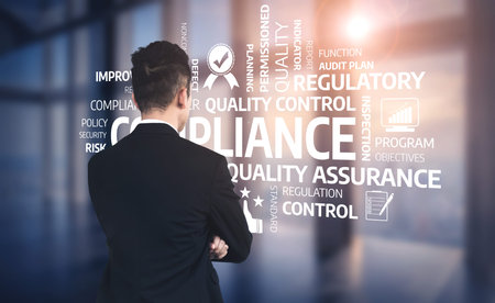 An engaged businessman contemplates compliance and quality control in a modern office space, highlighting strategic planning and regulatory concepts for corporate success. Tesselの写真素材