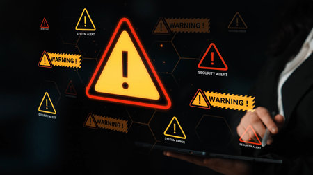 Bright warning and alert symbols illuminated on modern device screen highlighting system alerts and...