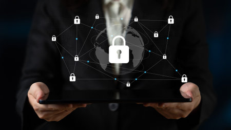 Business Professional Holding Tablet with Digital Global Network Security Concept Illustrating...