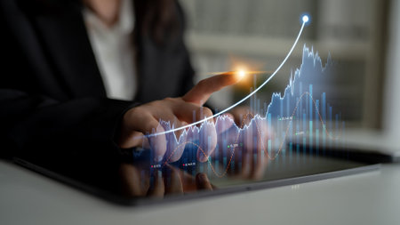 A business professional uses a digital tablet to analyze financial data, depicting an upward trend...