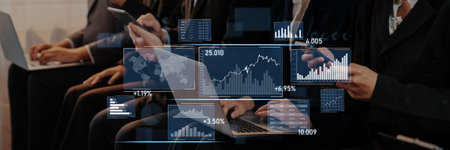 A group of business professionals uses various digital devices to analyze financial data and market...