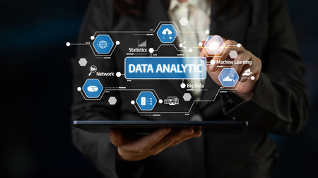 Business professional interacts with a digital interface displaying key concepts of data analytics...