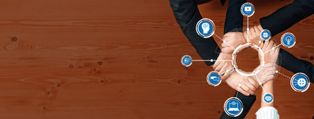 Conceptual image of diverse hands collaborating around a circular diagram with business and...