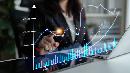 A business professional engages with digital financial data on a touchscreen, visualizing growth...
