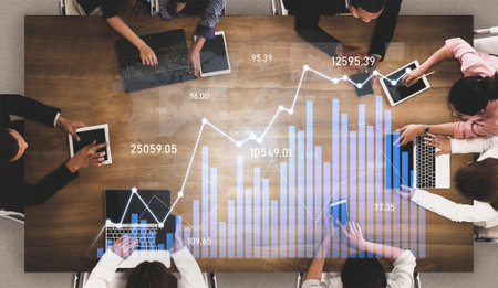 A diverse group of professionals engaged in collaborative data analysis, utilizing tablets and...