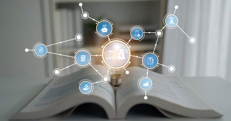 This image illustrates financial education, showcasing open books and coins surrounded by digital...