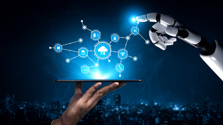 A robotic hand interacts with digital icons above a tablet, representing advanced technology and...
