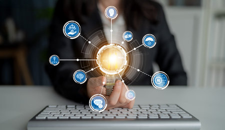 A business professional engages with digital icons showcasing concepts of technology and innovation,...