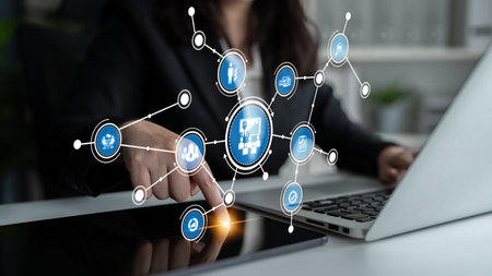 A businesswoman interacts with a laptop displaying a digital interface, representing data analysis...