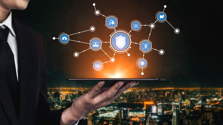 A businessman in a suit holds a tablet displaying digital icons that signify technology and security...