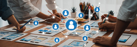A dynamic networking session unfolds as a diverse team collaborates, sharing ideas and sketches for...