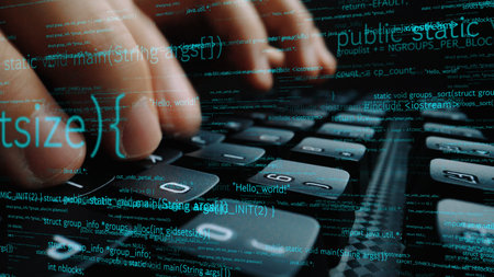 Close-up of hands on a keyboard, showcasing a dynamic coding environment with glowing text...
