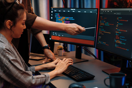 IT developers discussing with point to intelligent website development coder system running data...