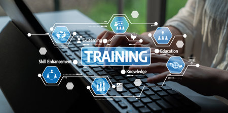 This image illustrates the concept of online training, showcasing elements of e-learning and skill enhancement around a computer keyboard, symbolizing modern education. Tesselの写真素材