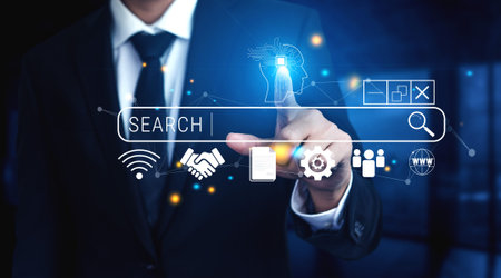 Businessman Interacting with Digital Search Bar and Modern Icons Representing Technology and Connectivity in a Professional Environment.の写真素材