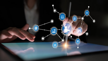 A business professional interacts with a digital tablet, showcasing various connectivity icons...