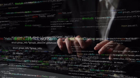 A programmer is seen typing on a keyboard in a dimly lit room, surrounded by a vibrant display of...