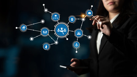 A business professional engages with a digital interface, highlighting data connections and...