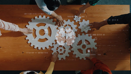 A diverse group of individuals collaborates on a digital project, using gear models to symbolize innovation and teamwork in a modern workspace, showcasing creativity and strategic thinking. Rasterの写真素材