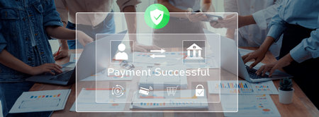 Business team celebrates successful payment confirmation with digital tools in an office setting,...
