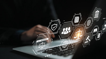 Digital Justice System Concept with Legal Icons Floating Above Laptop Keyboard in Dark Environment...