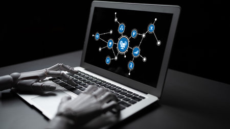 A robotic hand interacts with a laptop displaying a digital connection interface, symbolizing the...