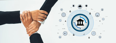 Hands of diverse people joined together showcasing collaboration in business settings, with digital icons symbolizing finance, teamwork, and growth in a modern context.の写真素材